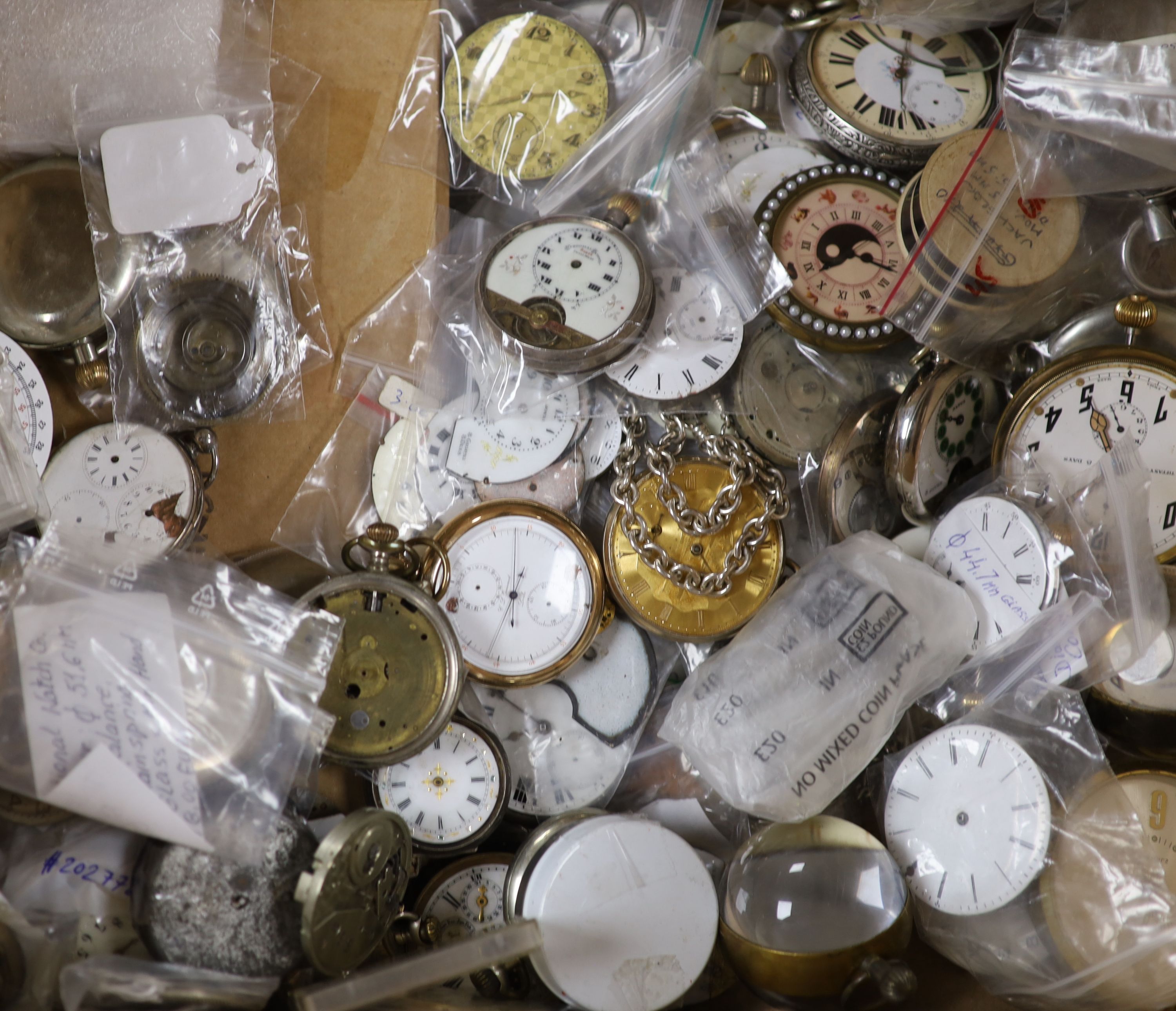A large quantity of assorted pocket watch movements, parts and accessories